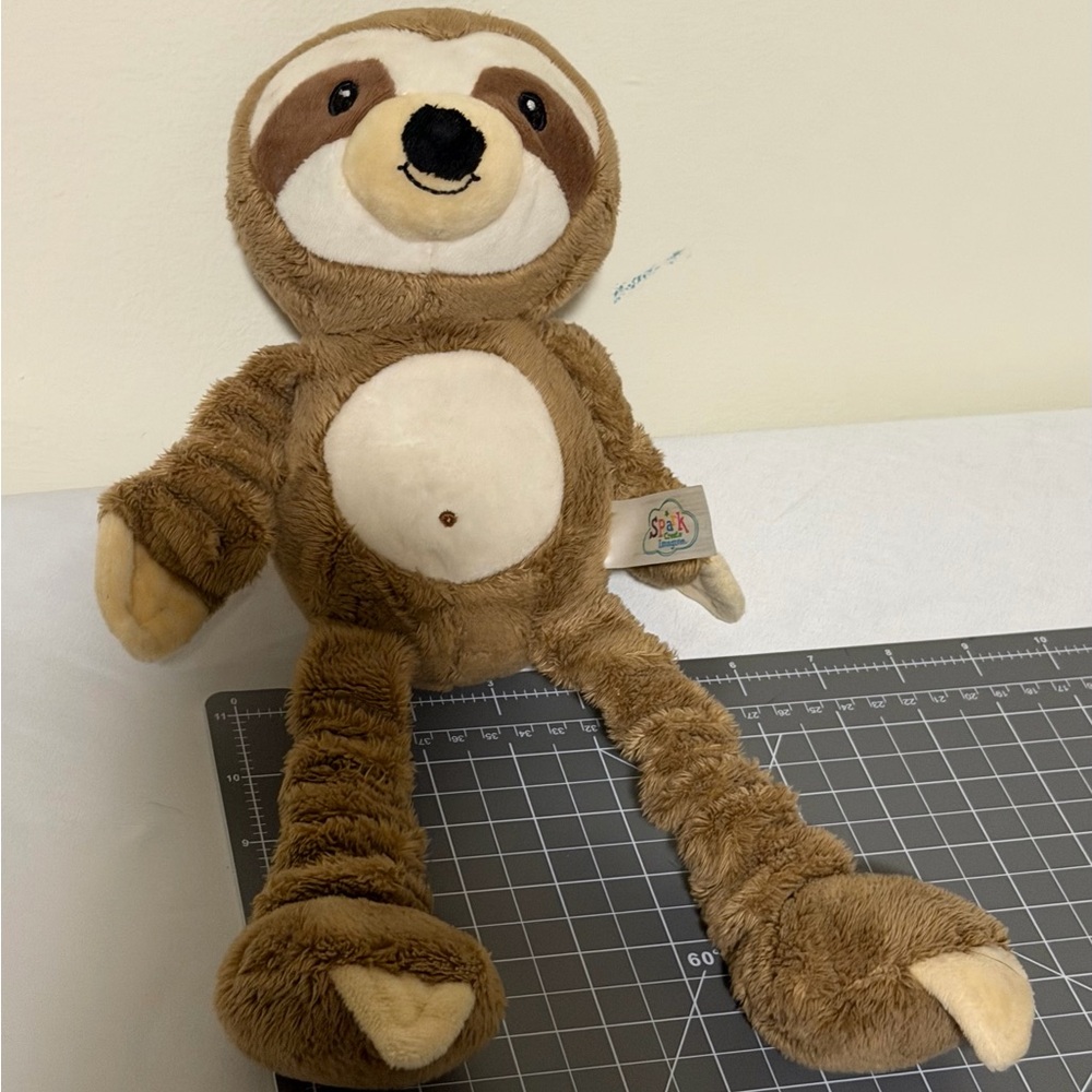 Spark Created Imagine sensory sloth plush. Crinkle. Rattle. Squeak. Stretch